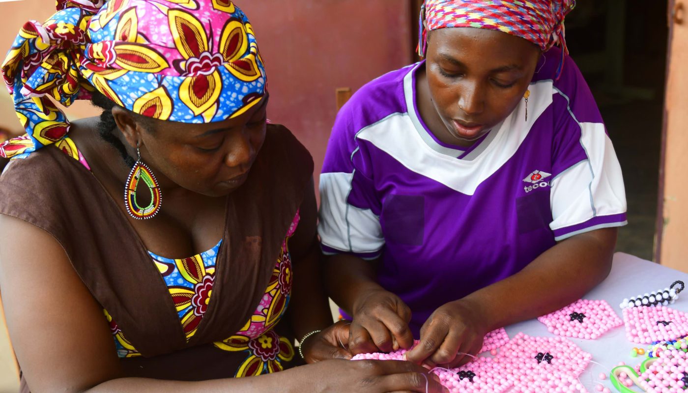 Displaced women learn to make crafts using beads Yaounde. 'I teach others because I see a lot of young girls, some young mothers who have nothing to do, and who have no work. So, if we can work together, we can produce a lot of articles to sell to a wide market.' - Zainabou Abou, 33, is a Central African refugee who teaches women in Cameroon's capital Yaounde, to make crafts using beads. ; Zeinabou fled the Central African Republic in 2014, when lootings, rapes and beheadings spread to her neighborhood in Bangui. She was sheltered by a friend in Cameroon’s capital city Yaounde, a nun who taught her how to use beads to make all kinds of crafts. Years later, she has turned her craft making into a lucrative business and shares her skills with anyone who is ready to learn.